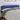 Tăblie de pat cu LED, albastru, 180x7x78/88 cm, textil