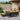 Set mobilier de exterior cu perne, 11 piese, negru, poliratan